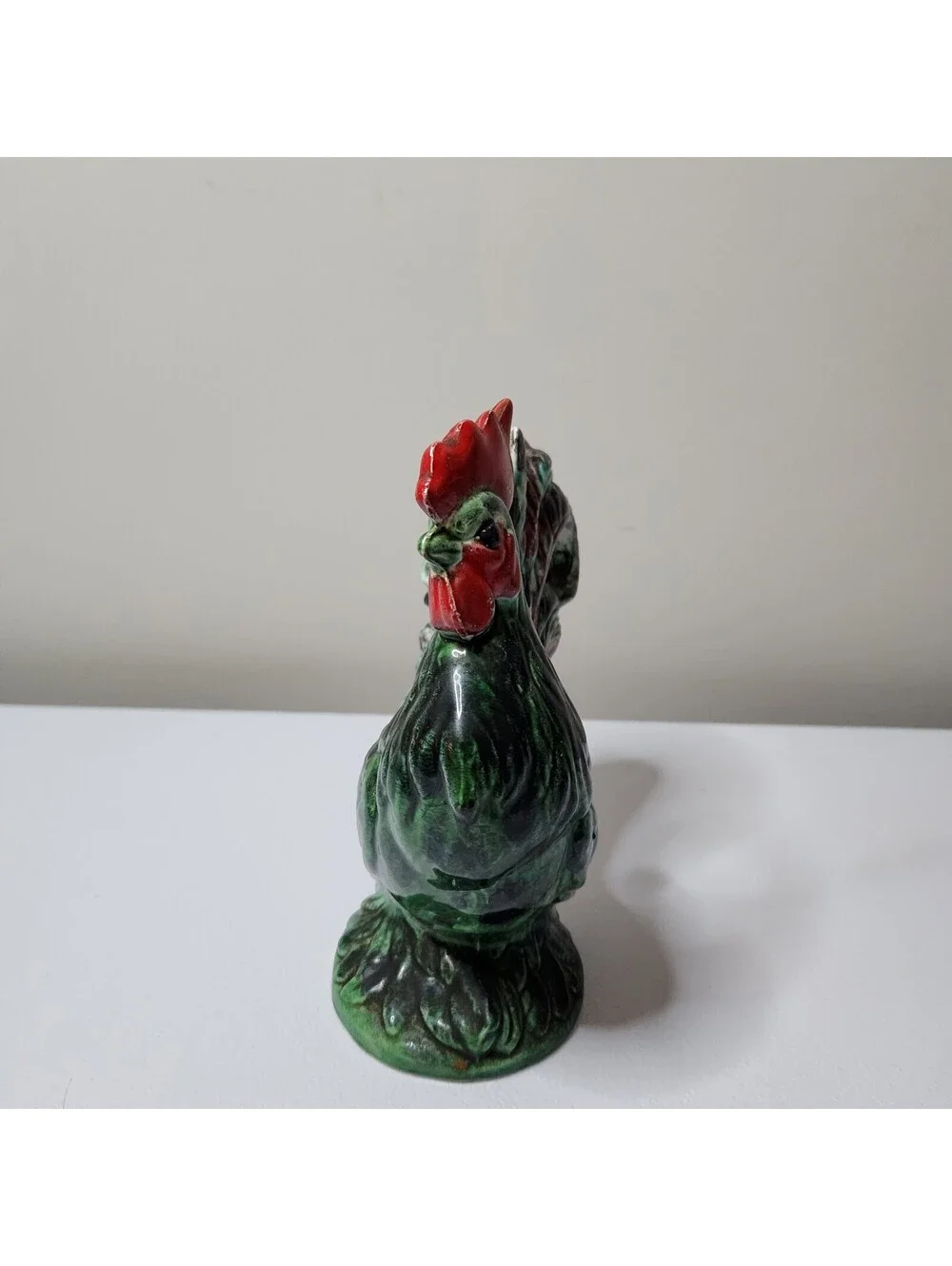 Green ceramic rooster figurine